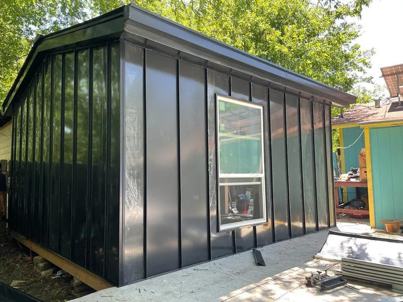 Black standing seam metal wall panels for Roof Inspection in Greenburgh