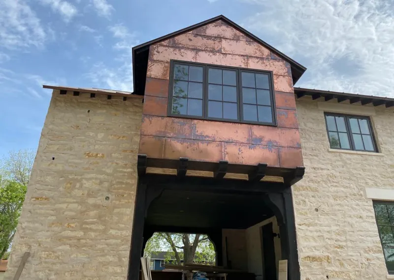 Copper metal panel facade on a stone building for Metal Roof Coating in Greenburgh